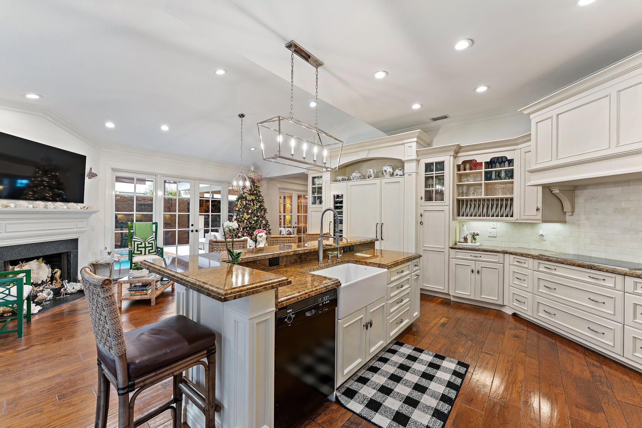 3230 West Channel Circle Jupiter, FL 33477 - Photo 27 of 67 a kitchen with sink stove and cabinets