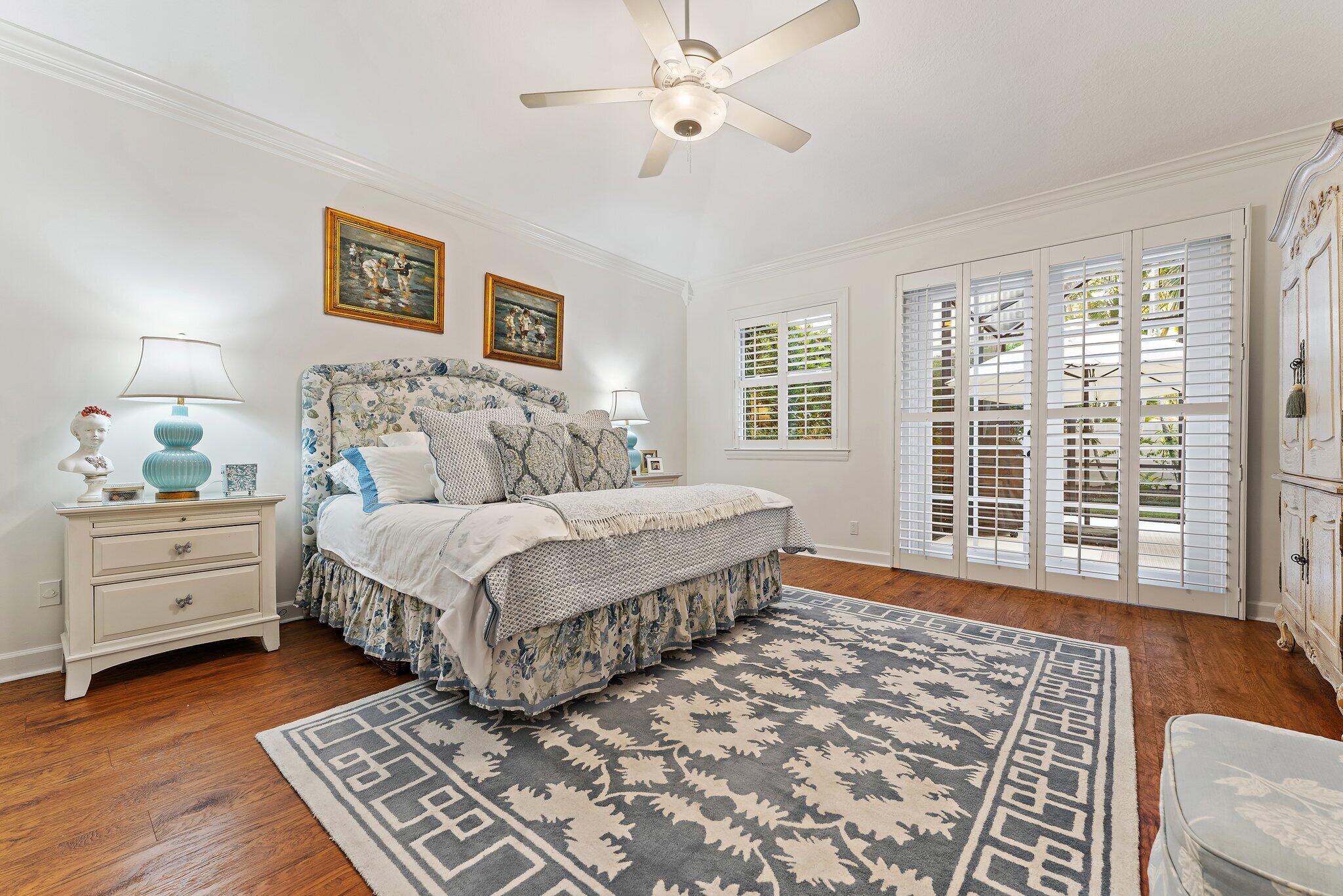 3230 West Channel Circle Jupiter, FL 33477 - Photo 30 of 67 a spacious bedroom with a large bed and a window