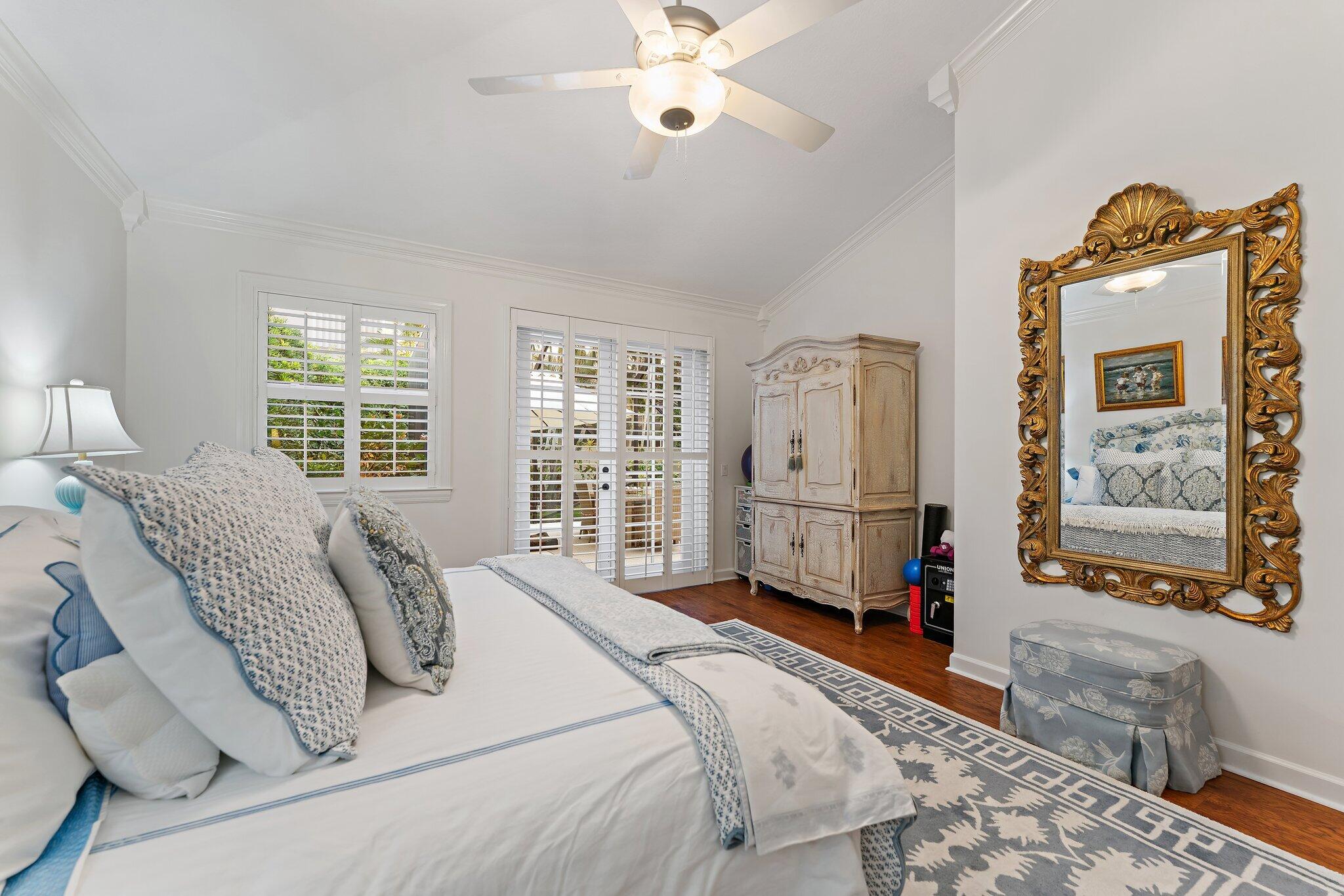 3230 West Channel Circle Jupiter, FL 33477 - Photo 31 of 67 a spacious bedroom with a bed a couch and a window