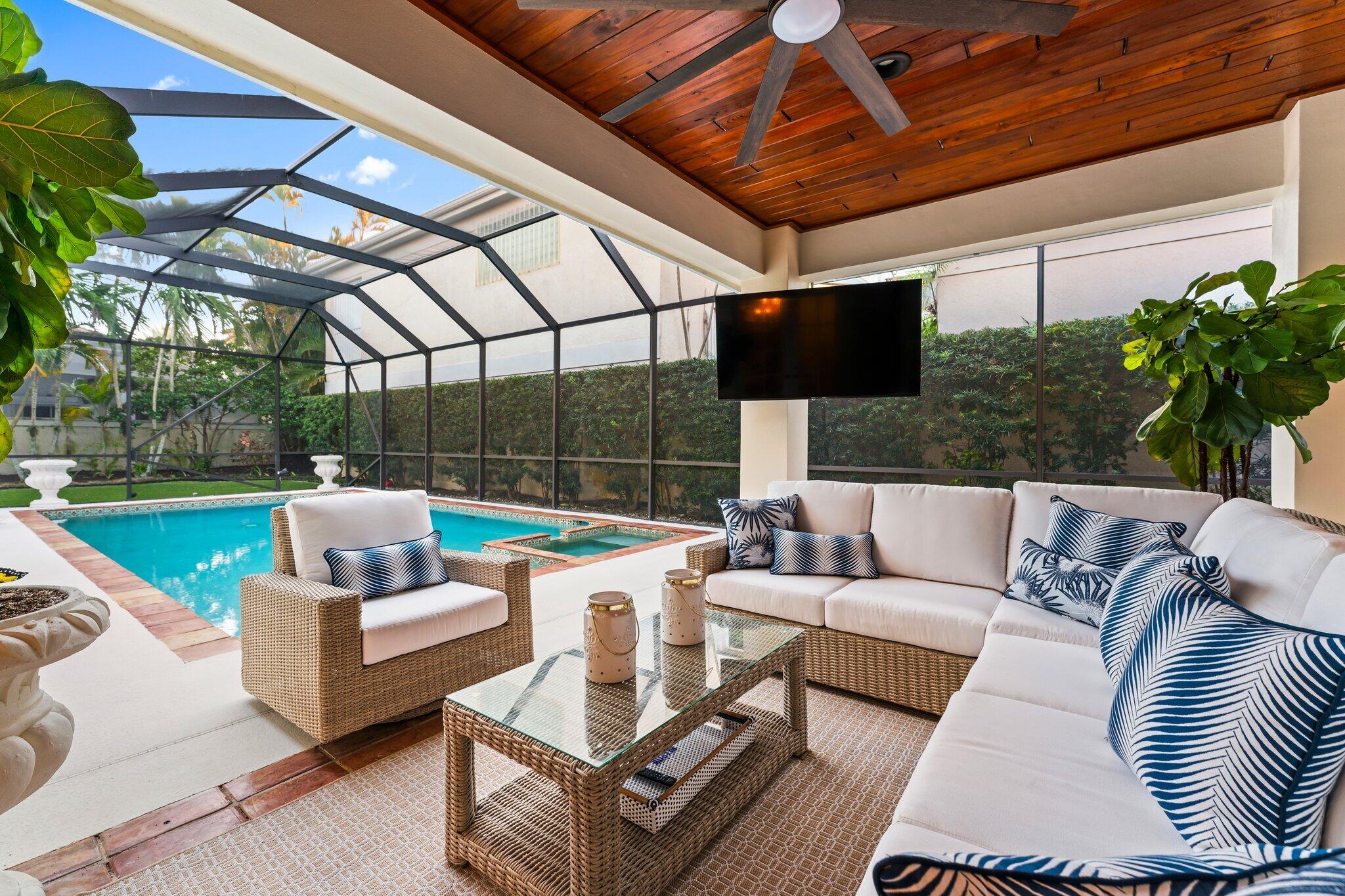 3230 West Channel Circle Jupiter, FL 33477 - Photo 38 of 67 a view of a patio with couches chairs and a table