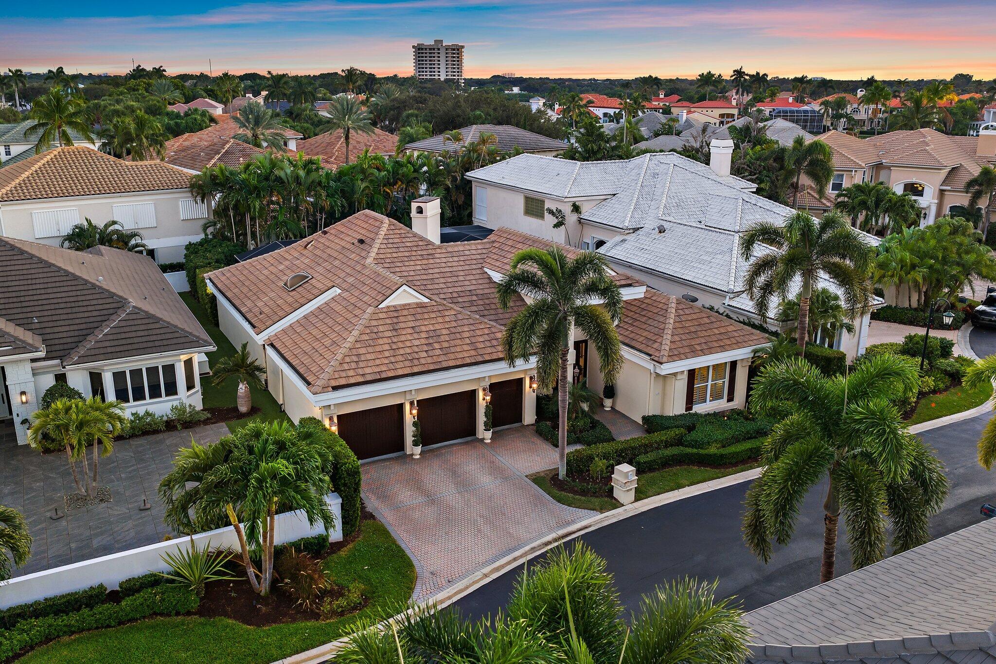 3230 West Channel Circle Jupiter, FL 33477 - Photo 48 of 67 an aerial view of multiple houses with a yard