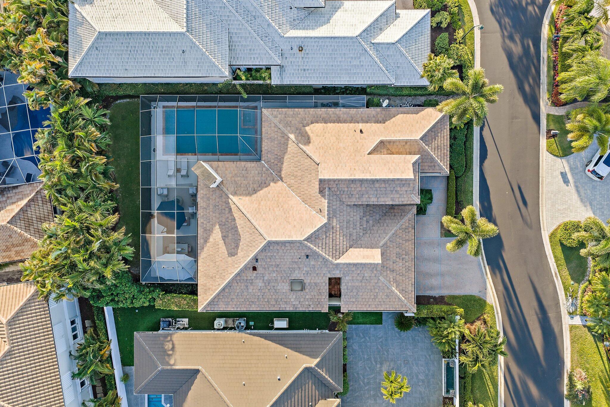 3230 West Channel Circle Jupiter, FL 33477 - Photo 5 of 67 an aerial view of a house with swimming pool