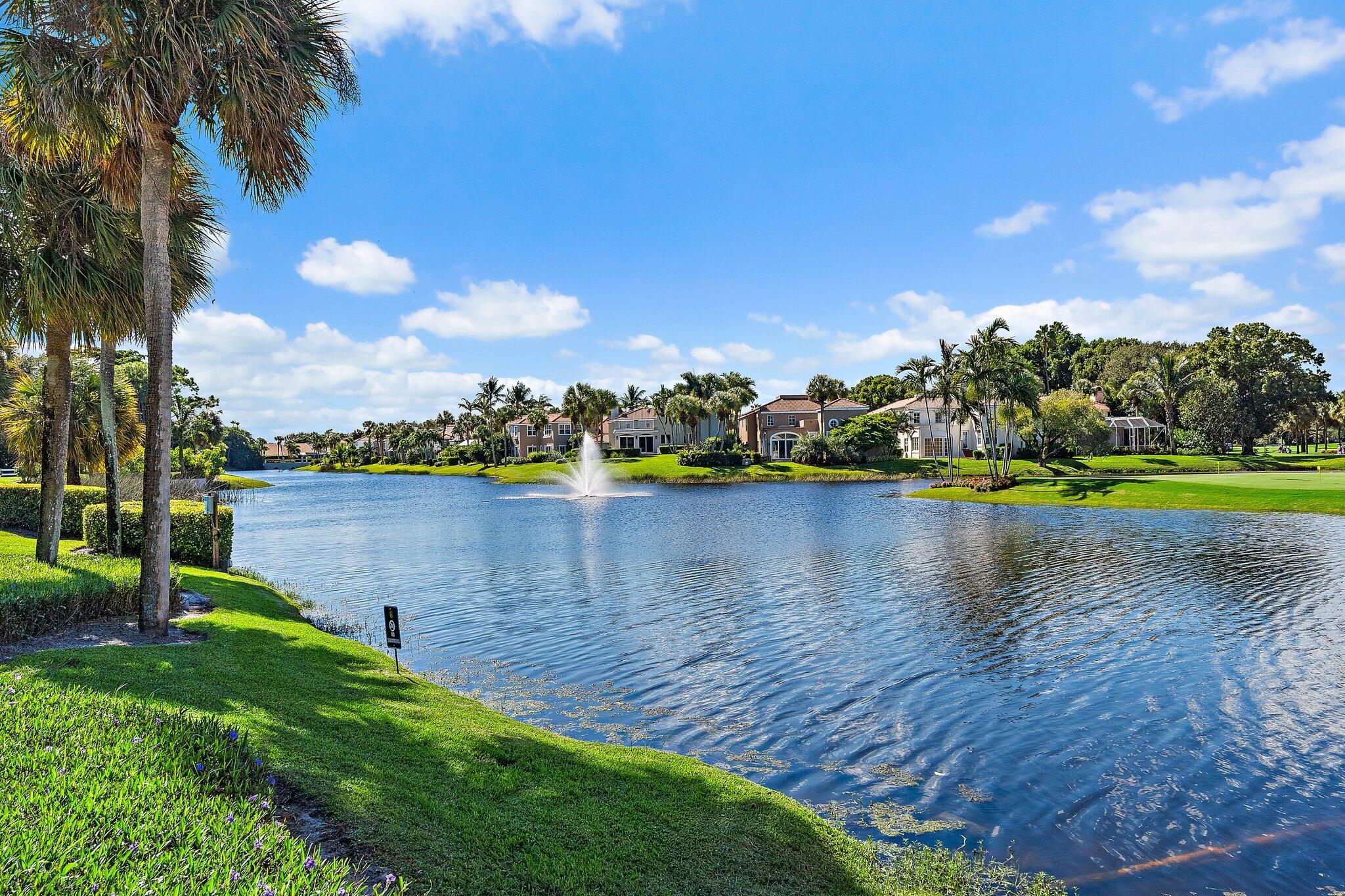3230 West Channel Circle Jupiter, FL 33477 - Photo 55 of 67 a view of a lake with houses in the back