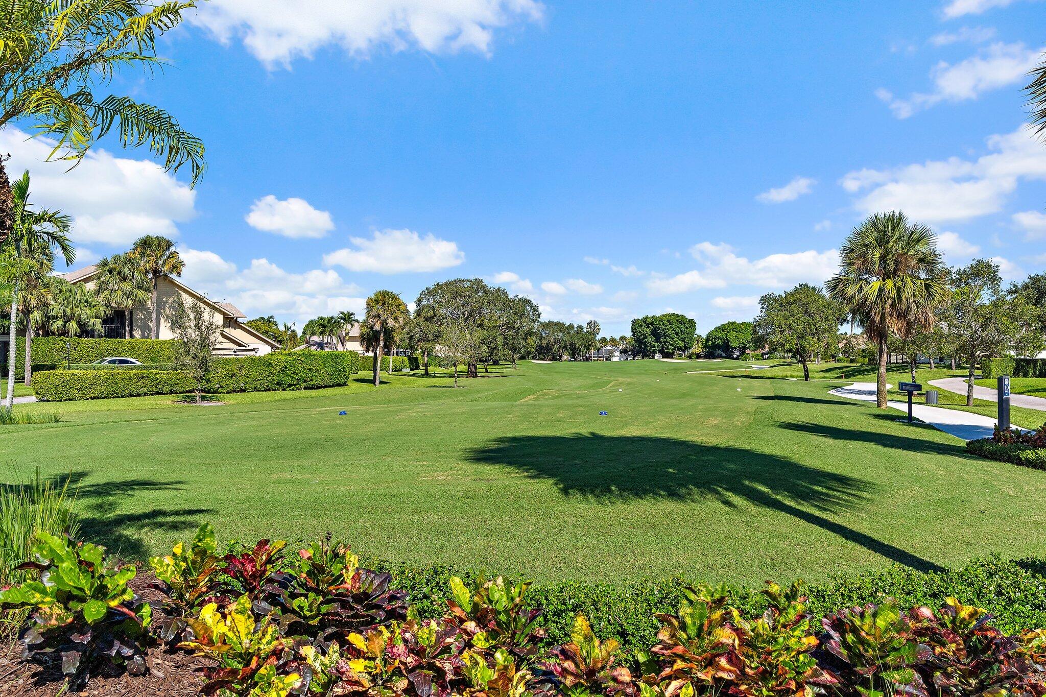 3230 West Channel Circle Jupiter, FL 33477 - Photo 56 of 67 a view of a golf course with a lake