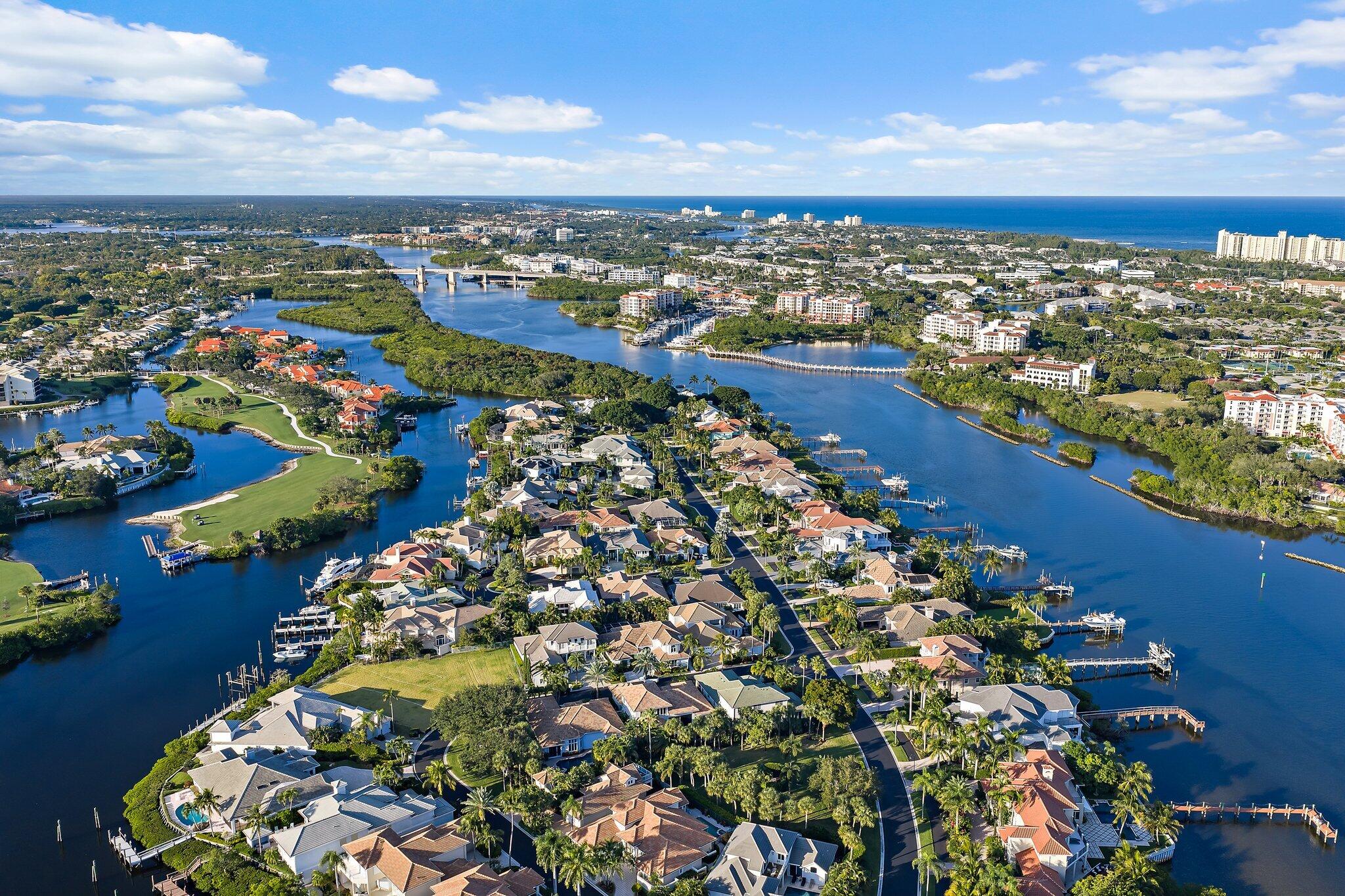 3230 West Channel Circle Jupiter, FL 33477 - Photo 61 of 67 an aerial view of a residential houses with outdoor space