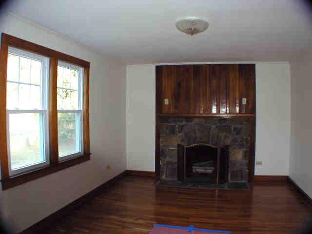 591 Colebrook River Road Tolland, MA 01034 - Photo 3 of 10 a view of an empty room with wooden floor and a window