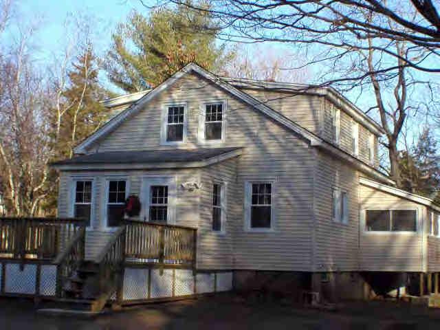 591 Colebrook River Road Tolland, MA 01034 - Photo 7 of 10 a front view of house with yard