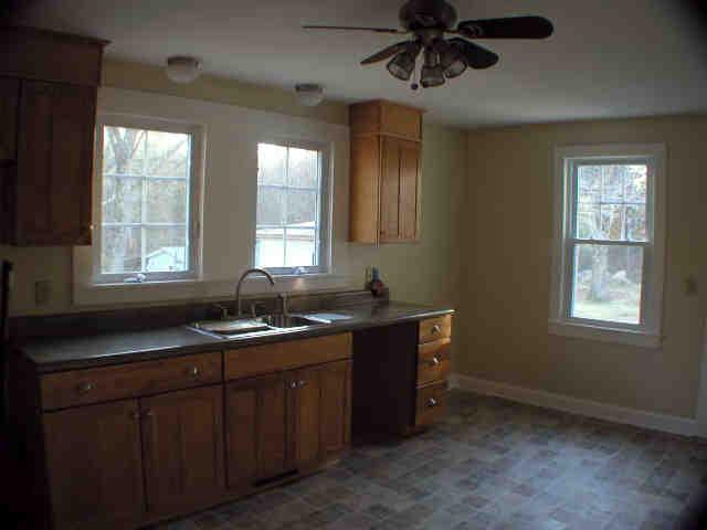 591 Colebrook River Road Tolland, MA 01034 - Photo 9 of 10 a kitchen with a sink cabinets and window