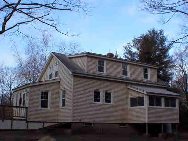 591 Colebrook River Road Tolland, MA 01034 - Photo 10 of 10 a front view of a house with a yard
