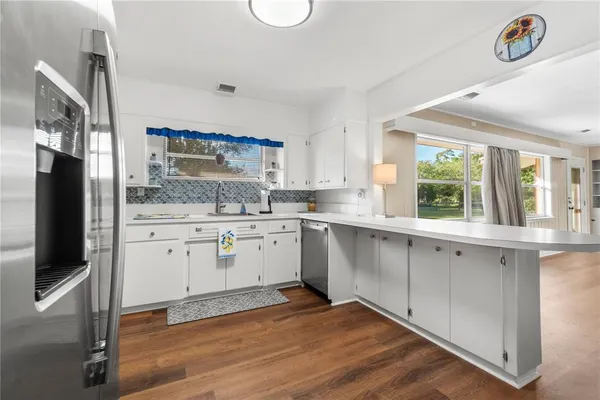 a bathroom with a tub sink toilet and shower
