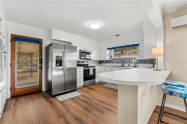 a view of a room with rack on the wall and a window