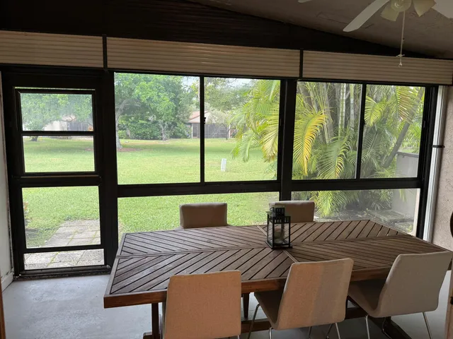 a view of a city from a dining room with large windows