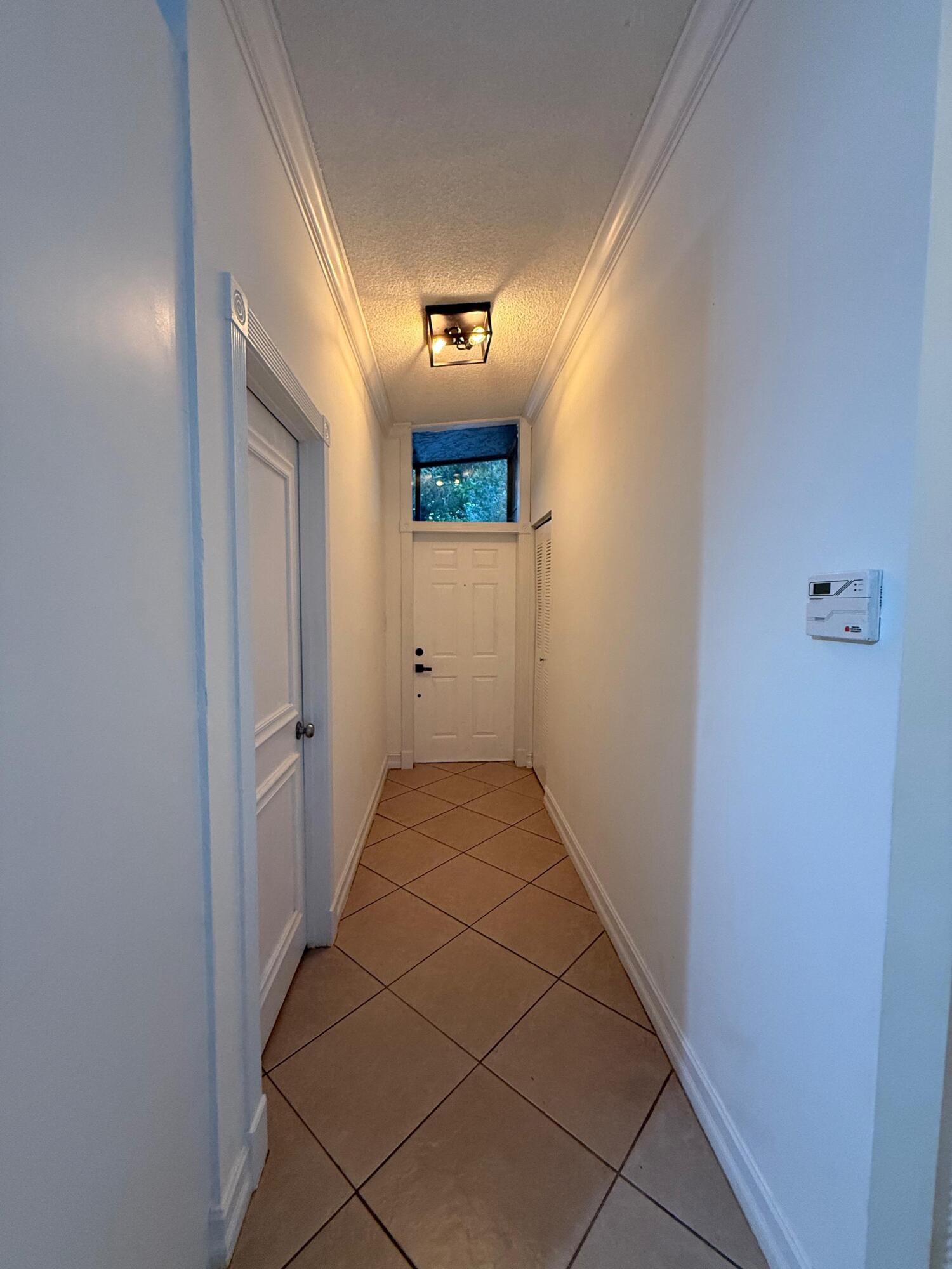 22293 Misty Woods Way Boca Raton, FL 33428 - Photo 5 of 23 a view of a hallway