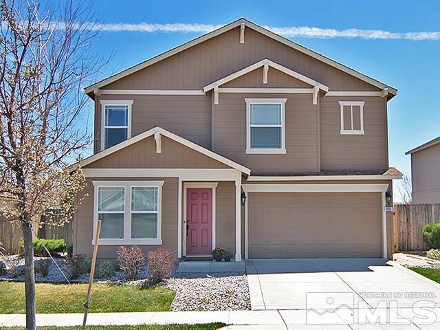 9050 Convair Way Reno, NV 89506 - Photo 1 of 25 a front view of a house with a yard