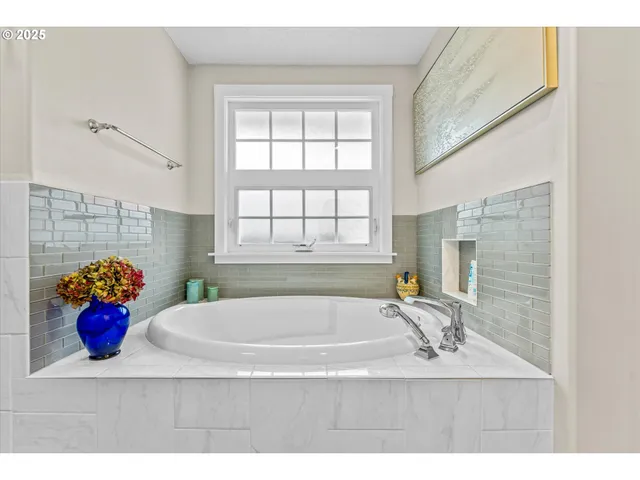 a bathroom with a shower and a sink