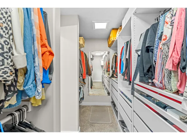 a bathroom with a granite countertop sink double vanity and a mirror