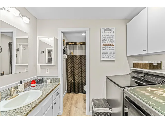 a kitchen with a refrigerator and a stove