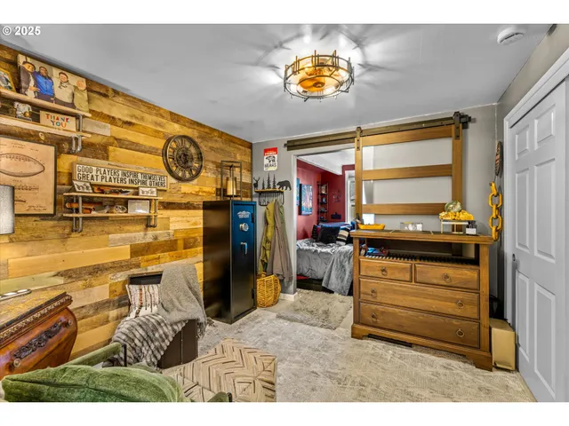 a view of a deck with a big yard and a large tree