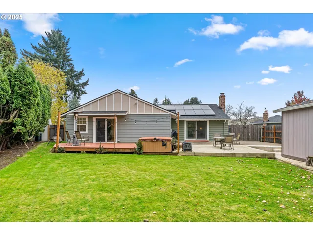a front view of house with yard and outdoor seating