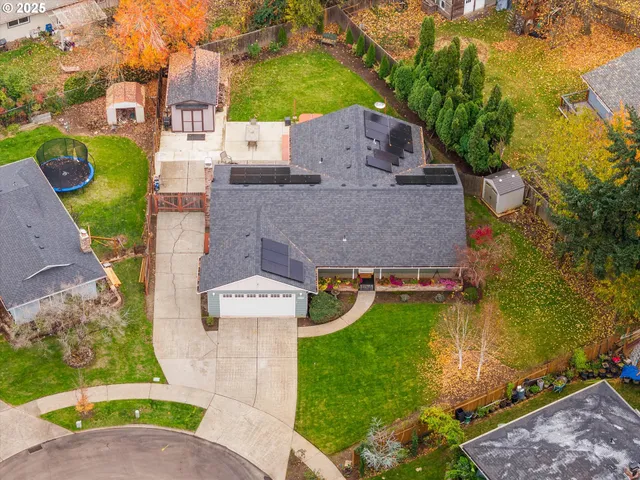 an aerial view of a house with a garden