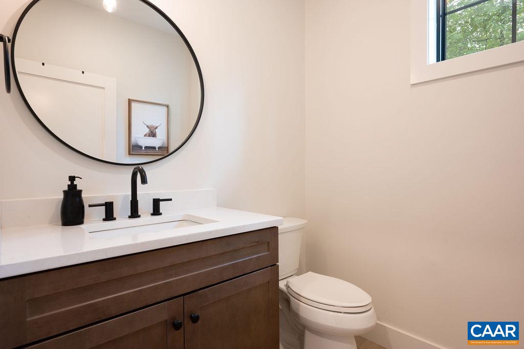 92 Key W Drive Charlottesville, VA 22911 - Photo 13 of 27 a bathroom with a toilet a sink and a mirror