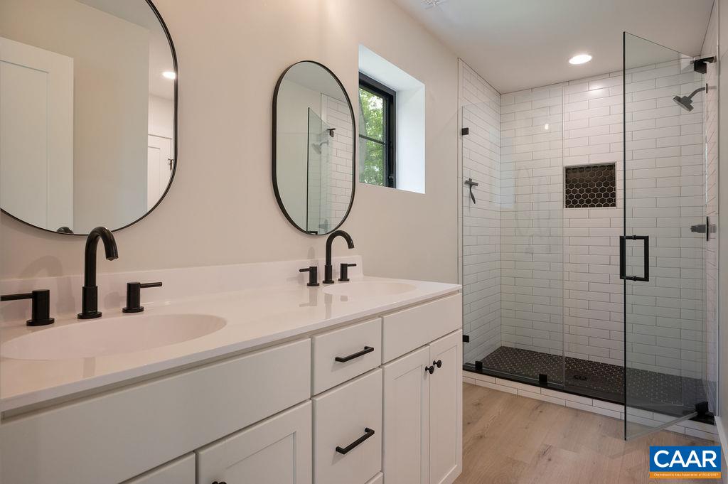 92 Key W Drive Charlottesville, VA 22911 - Photo 17 of 27 a bathroom with a sink and a mirror