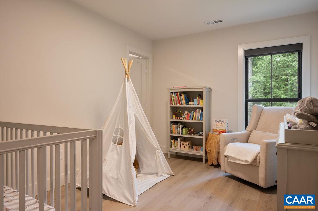 92 Key W Drive Charlottesville, VA 22911 - Photo 21 of 27 a living room with furniture and a book shelf