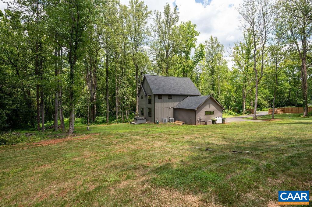 92 Key W Drive Charlottesville, VA 22911 - Photo 23 of 27 a house with a big yard and large trees