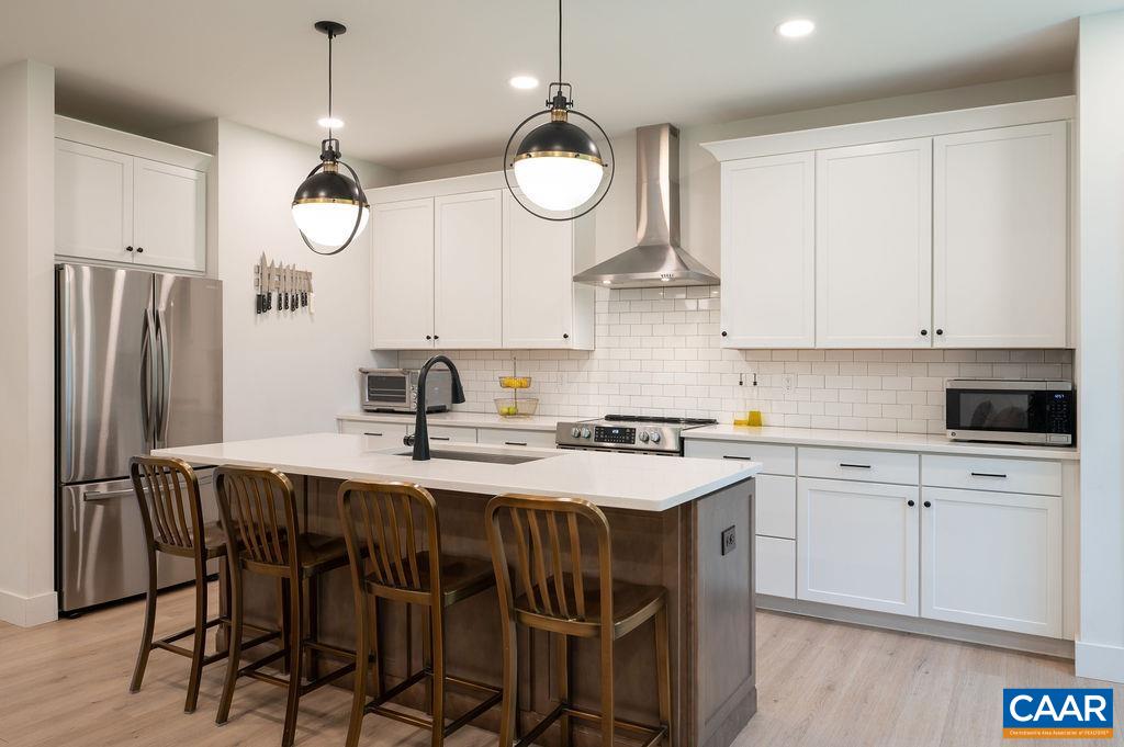 92 Key W Drive Charlottesville, VA 22911 - Photo 7 of 27 a kitchen with a table and chairs in it