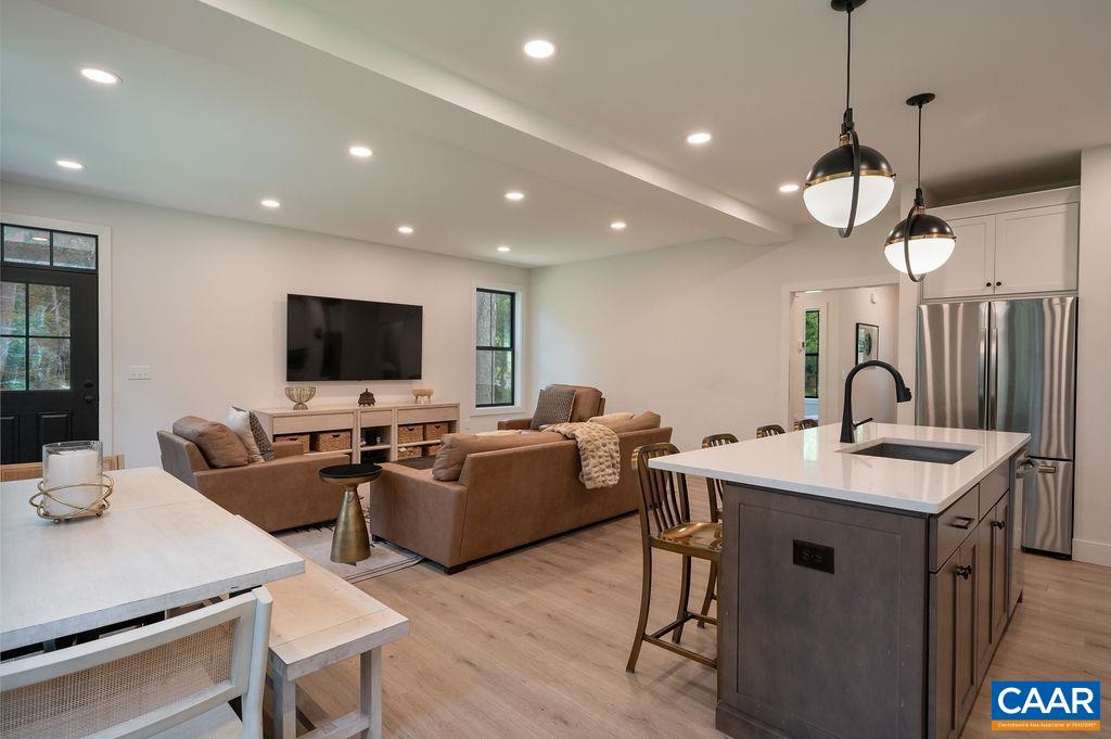 92 Key W Drive Charlottesville, VA 22911 - Photo 9 of 27 a view of a dining room with furniture a kitchen and chandelier
