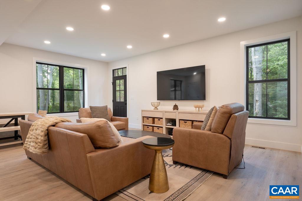92 Key W Drive Charlottesville, VA 22911 - Photo 10 of 27 a living room with furniture tv and wooden floor