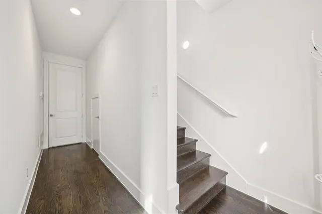 a view of entryway and hall with wooden floor