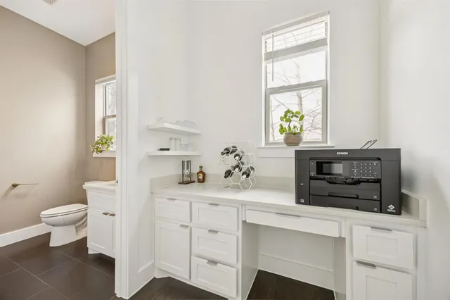 a kitchen with a stove a sink and a window
