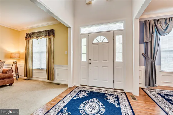 a view of a livingroom with furniture and a window