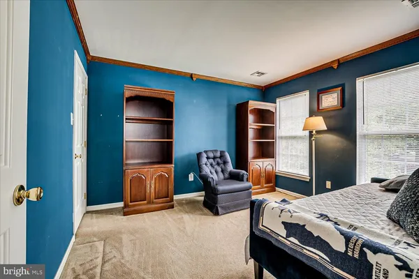 a bedroom with bed and a bathroom