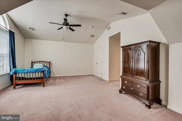 a view of a room with furniture air conditioner and windows