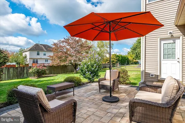 a view of a patio with couches and a table and chairs