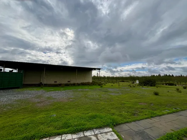 a backyard of a house with lots of green space