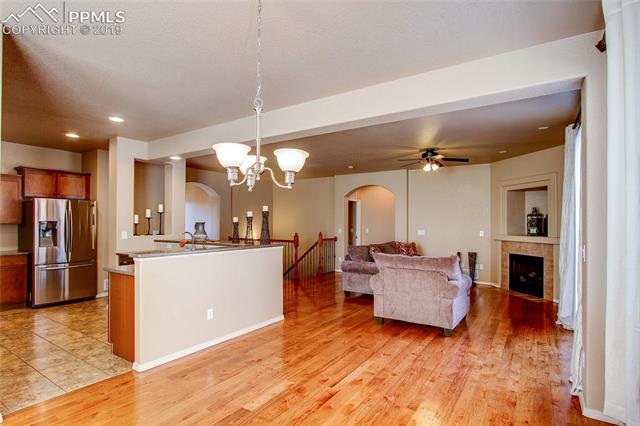 2384 Cinnabar Road Colorado Springs, CO 80921 - Photo 27 of 28 Hardwood floors and an open floor plan.
