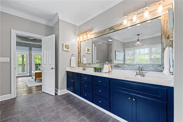 a backyard of a house with swimming pool and large trees
