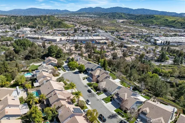 an aerial view of a house with a yard and a garden