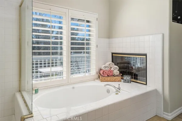 a bathroom with double vanity sinks and a mirror