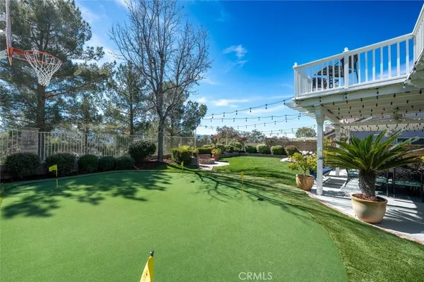 an aerial view of a house with a yard and garden