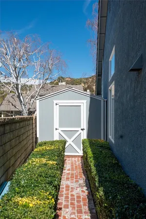 a view of a chair and tables in the patio