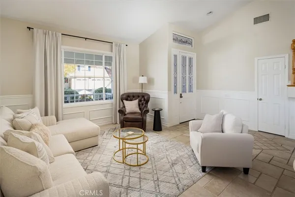 a living room with furniture and a window
