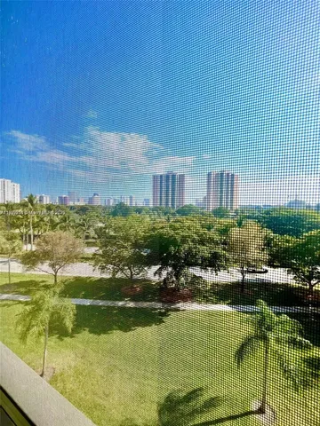 a view of a swimming pool with an outdoor seating