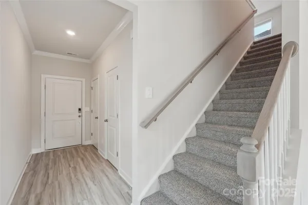 a view of entryway with wooden floor