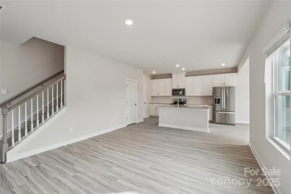 a view of kitchen with wooden floor
