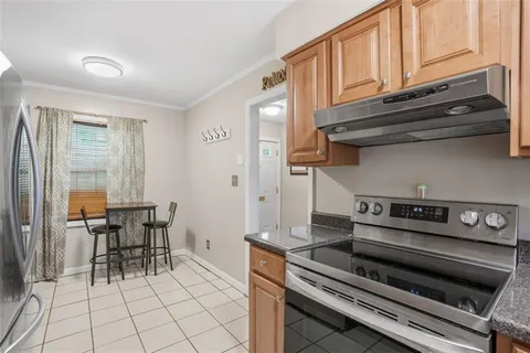 a kitchen with a stove and a cabinets
