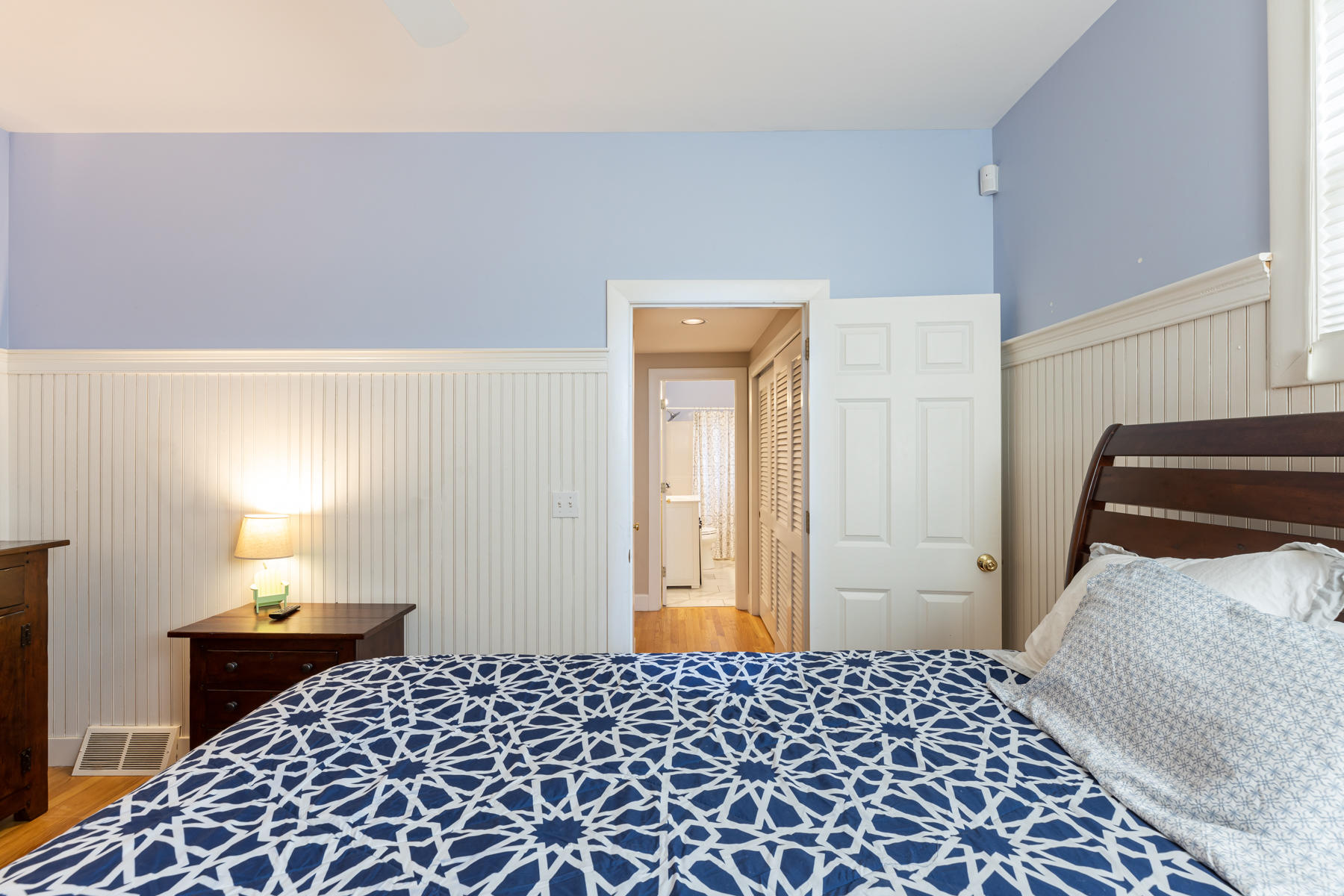185 Uncle Percy's Road Mashpee, MA 02649 - Photo 11 of 21 a bedroom with a bed and a lamp